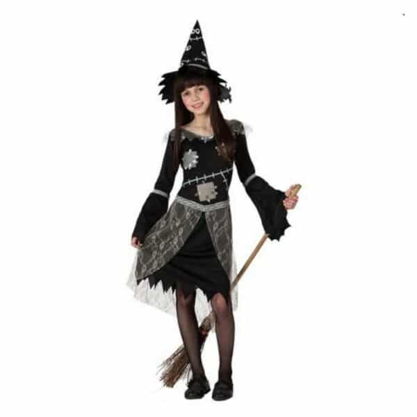 Déguisement Sorcière pour Enfants, couleur noir portée par une petite fille avec un chapeau complet
