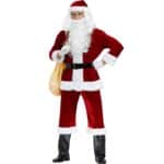 homme qui porte un déguisement de Noël avec sur l'épaule le sac dans lequel il met les cadeaux , il porte également une barbe blanche et un bonnet de Noel