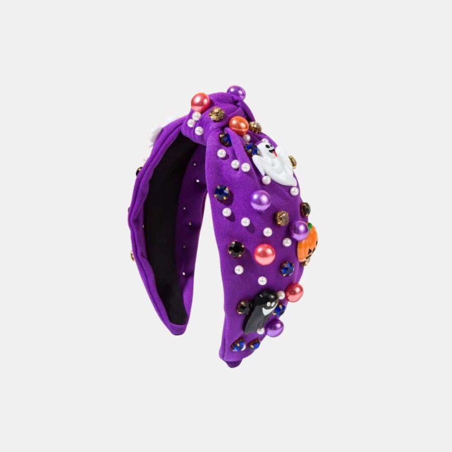 Serre-tête violet avec des motifs d'Halloween et de fantômes, sur fond gris