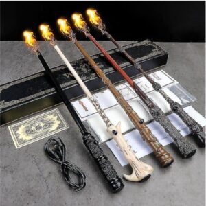 on voit 5 baguettes magiques les unes à côté des autres, posées sur un support avec le chargeur à côté